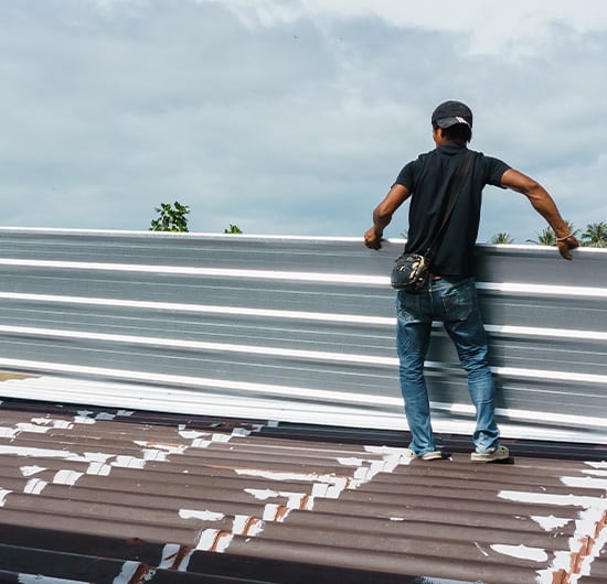setting up panels on top of roof, roof maintenance