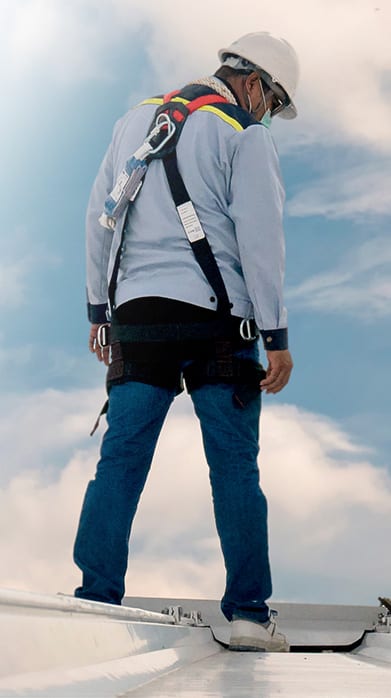 roof worker on top of roof